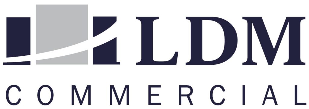 LDM Commercial logo with abstract design.